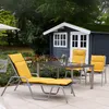 A patio set with a lounge chair, table, and chairs on a tiled patio in front of a dark blue garden shed. Produktbild-Vorschau