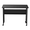 A black folding table with a shelf and wheels, shown from the front on a white background. Produktbild-Vorschau