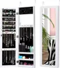 A white jewelry cabinet with a full-length mirror is shown open, displaying various jewelry and cosmetic items. Produktbild-Vorschau