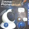 A product shot of a planetarium projector with promotional text and images. Náhled obrázku produktu