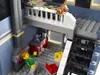 A close-up view of a Lego Pet Shop building, showing interior details and minifigures. Náhled obrázku produktu