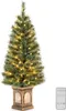 A decorated artificial Christmas tree in a pot with a remote control. Podgląd zdjęcia produktu