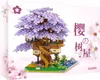 The image shows the packaging of a building block set featuring a cherry blossom treehouse. Náhľad obrázku produktu