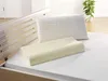 Two pillows on a bed with a wooden bed frame. Produktbild-Vorschau