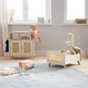 A doll's changing station and crib set up in a nursery-like setting. Anteprima dell’immagine prodotto