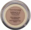 A top-down view of a Max Factor Miracle Touch foundation compact. Podgląd zdjęcia produktu
