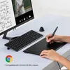 A person is using a drawing tablet and stylus on a desk with a computer monitor and keyboard. Náhled obrázku produktu