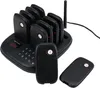 A black restaurant pager system with multiple pagers docked on a charging base, with two pagers in the foreground. Anteprima dell’immagine prodotto