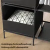 Close-up of a black fabric storage unit with a patterned pillow inside one of the compartments. Text is present at the bottom of the image. Produktbild-Vorschau