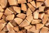 A close-up view of a pile of chopped firewood. Podgląd zdjęcia produktu