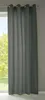 A dark gray curtain hanging in front of a window with trees visible outside.