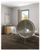 A dining room with a table set for a meal, featuring a close-up of a hanging lamp. Produktbild-Vorschau