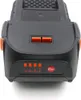 A close-up view of a black power tool battery with orange accents and indicator lights. Produktbild-Vorschau