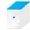 A stack of clear vacuum seal bags with blue sealing strips and a blue valve on one bag. Voir les images du produit