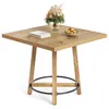 A square wooden table with a floral arrangement and a bowl of fruit on top. Podgląd zdjęcia produktu