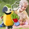 A plush parrot toy is shown with two children in an outdoor setting. Anteprima dell’immagine prodotto