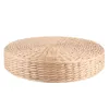 A round, thick seat cushion pouf made of woven natural material, presented against a white background. Voir les images du produit
