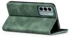 A green flip case for a smartphone is shown standing upright. Produktbild-Vorschau