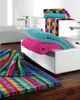 Colorful towels are arranged in a modern bathroom setting, with sinks and faucets visible. Produktbild-Vorschau