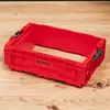 A red Qbrick System Pro Box Extender 2.0 module is placed on a wooden surface. Anteprima dell’immagine prodotto