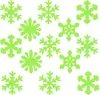 A collection of green snowflake-shaped cutouts arranged on a white background. Podgląd zdjęcia produktu