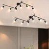 Two black track light fixtures mounted on a white ceiling. Podgląd zdjęcia produktu