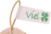 A close-up of a plush toy's tag with the word 'Viel' and a four-leaf clover. Produktbild-Vorschau