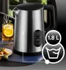 A stainless steel electric kettle with a digital display and a glass of tea with lemon. Produktbild-Vorschau
