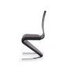 A side view of a modern chair on a white background. Voir les images du produit