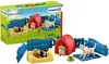 A Schleich Farm Worlds Welpenstube playset, including toy puppies, kennels, and fencing, displayed in front of its packaging. Produktbild-Vorschau