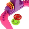A close-up shot of a toy projector with colorful discs. Náhľad obrázku produktu