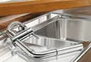 A close-up shot of a modern kitchen sink with a chrome faucet. Náhled obrázku produktu