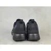 The back view of a pair of black Adidas Terrex outdoor shoes. Produktbild-Vorschau