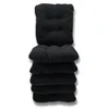 A stack of black seat cushions. Produktbild-Vorschau