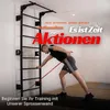A man is exercising with a resistance band attached to a wall-mounted pull-up bar and wall bars. Produktbild-Vorschau