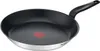 A close-up studio shot of a TEFAL frying pan. Voir les images du produit