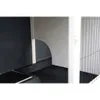 A close-up view of the interior of a pet habitat, showing a ramp and a curved entrance. Voir les images du produit