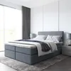 A modern bedroom with a large bed, bedside tables, and curtains. Produktbild-Vorschau