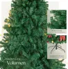 A close-up view of a green artificial Christmas tree with decorative elements and text overlays. Náhled obrázku produktu