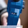 A close-up shot of a blue power tool with an LED light feature, held by a person. Produktbild-Vorschau