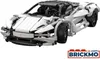 A white and black Lego-style sports car is shown from a front-side angle against a white background. A logo and text are visible in the bottom right corner. Produktbild-Vorschau