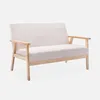 A beige two-seater sofa with wooden legs and arms is shown against a plain white background. Anteprima dell’immagine prodotto