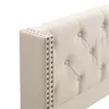 A close-up view of the tufted headboard of a bed, showing the studded trim. Produktbild-Vorschau