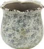 A close-up view of a decorative ceramic pot with a floral pattern. Voir les images du produit