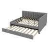 A gray upholstered daybed with a pull-out trundle bed extended. Náhľad obrázku produktu