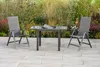 A garden furniture set with two chairs and a table on a patio, with a garden in the background. Produktbild-Vorschau