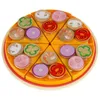 A wooden toy pizza cut into slices with various toppings. Podgląd zdjęcia produktu
