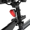 A close-up view of a red bicycle tail light attached to the seat post of a bicycle. Produktbild-Vorschau