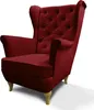 A red velvet wingback armchair with light wooden legs is shown against a white background. Náhled obrázku produktu