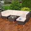 An outdoor lounge set on a wooden deck with a garden and water feature in the background. Anteprima dell’immagine prodotto